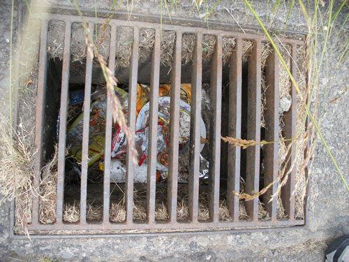 City storm drain inundated with trash